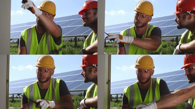 男性工程师讨论太阳能电池板故障