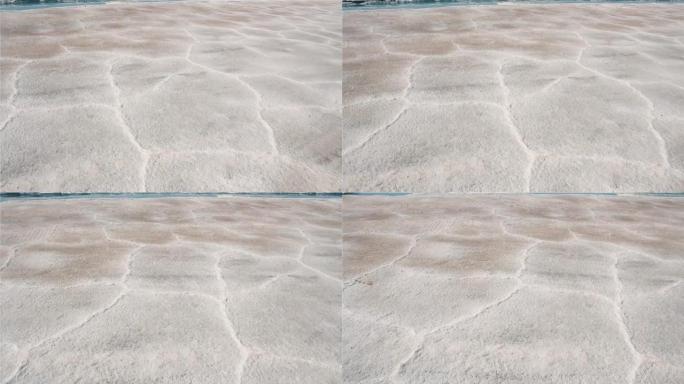 阿根廷萨尔塔萨利纳斯·格兰德斯盐滩的盐壳和干盐粉。地面视图。4k分辨率。