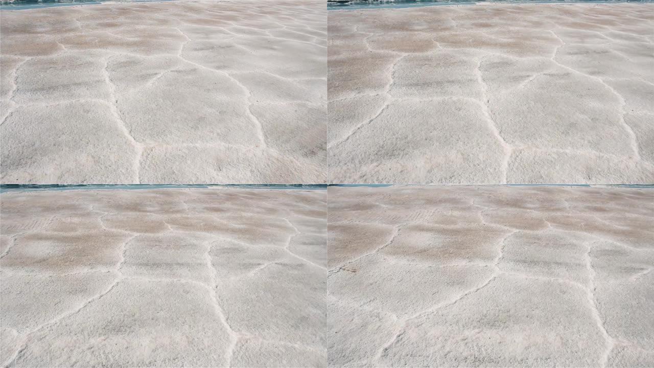 阿根廷萨尔塔萨利纳斯·格兰德斯盐滩的盐壳和干盐粉。地面视图。4k分辨率。