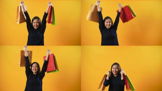 女人展示购物袋并感到快乐，购物狂