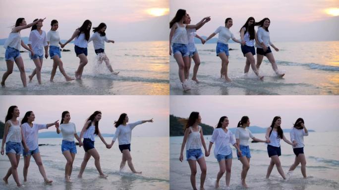 一群女性朋友在海滩上快乐和享受