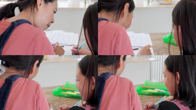 颜色，母亲和女孩用蜡笔，在家学习或结合家庭作业教育，在办公桌前快乐。女儿，妈妈是孩子的老师或玩活动，