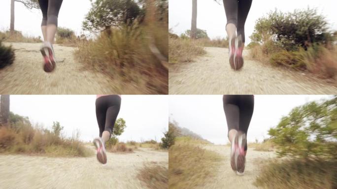 4k视频片段，一名妇女在泥泞的小路上慢跑