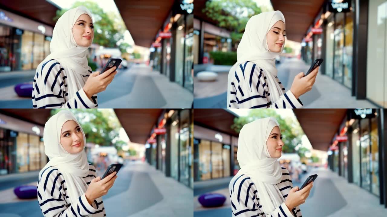快乐的穆斯林妇女使用在线购物应用程序搜索折扣。