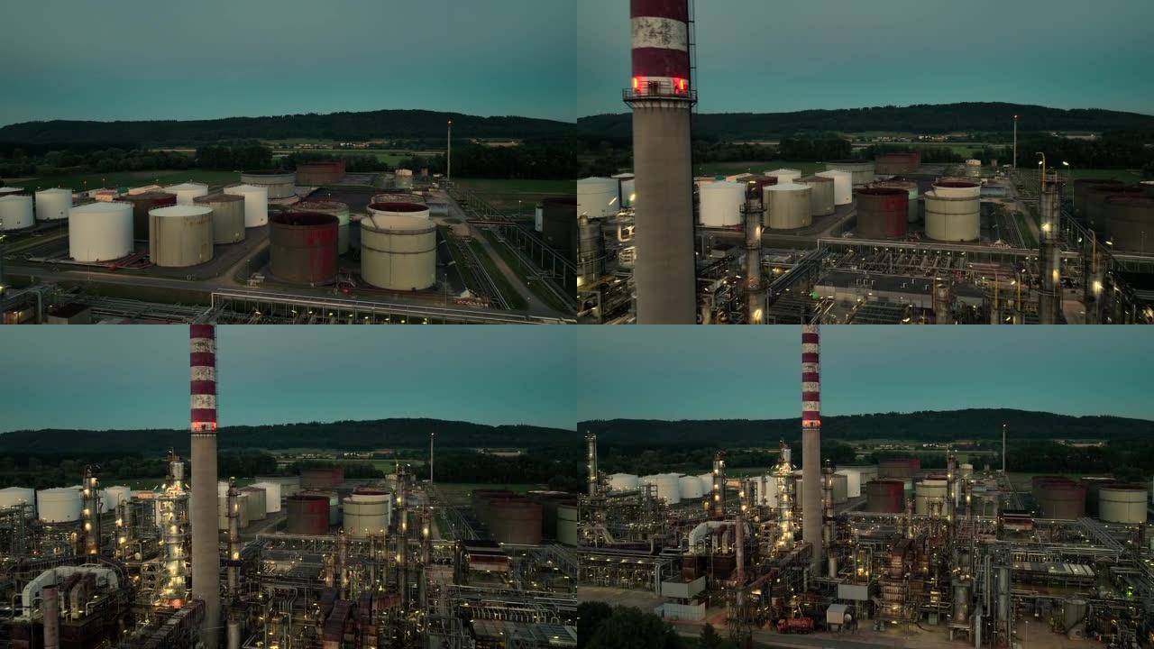 夜灯下气体燃料供应罐行业化工厂的鸟瞰图