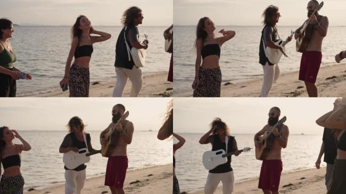 朋友在沙滩上唱歌和弹吉他