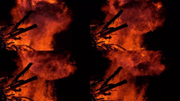 特写: 大篝火燃烧着壁炉里整齐堆放的柴火。