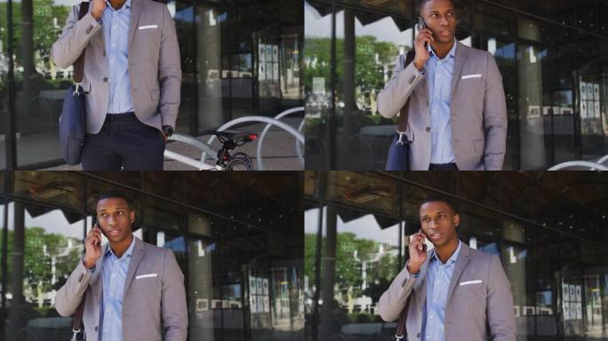 非裔美国商人在现代办公楼外的智能手机上聊天