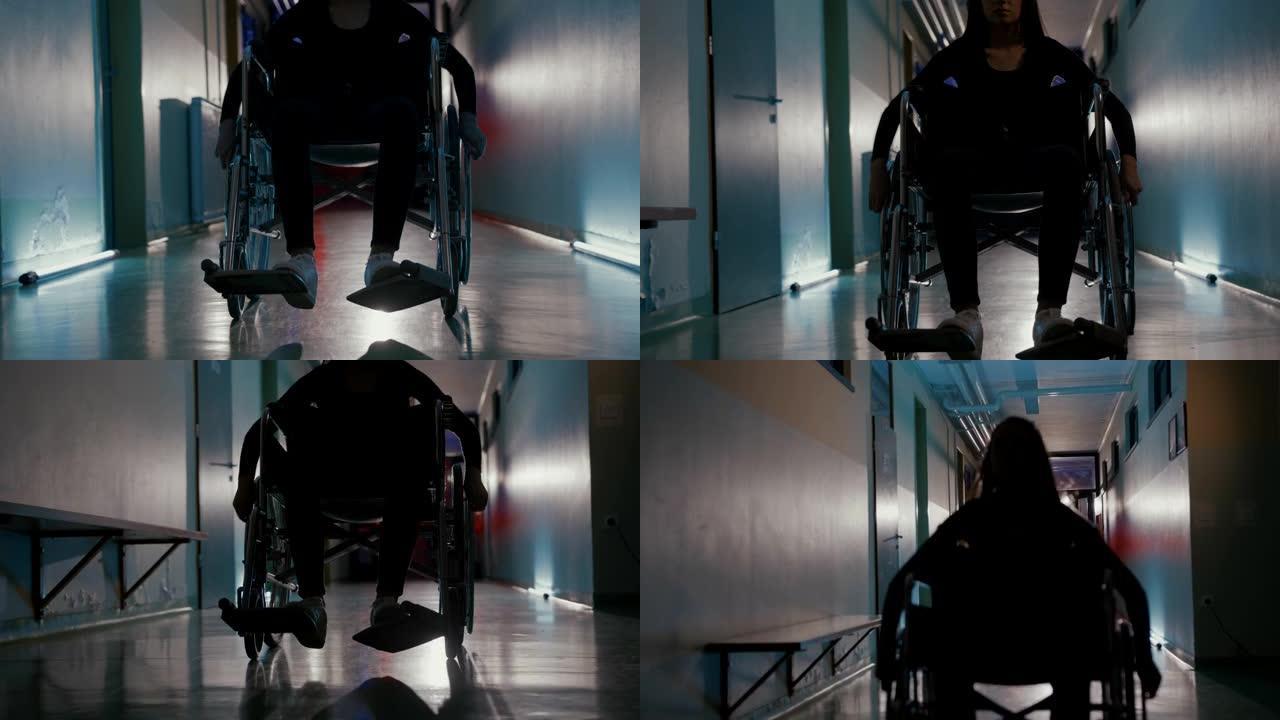 WS年轻的女患者在诊所走廊上推着轮椅