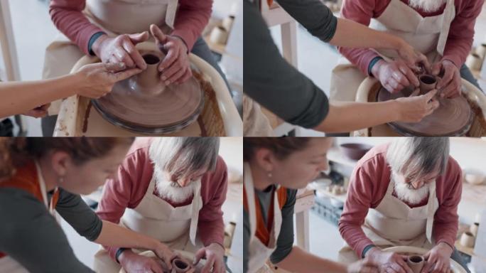 手，陶器和粘土与一名男子学生在工作室或陶瓷车间向女陶工学习。在课程中与一位女老师和一位男工匠一起创作