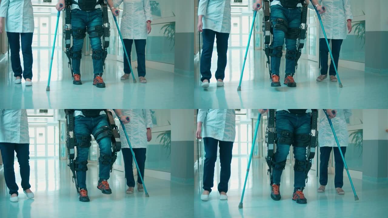 外骨骼中的一名患者正在护士的帮助下行走