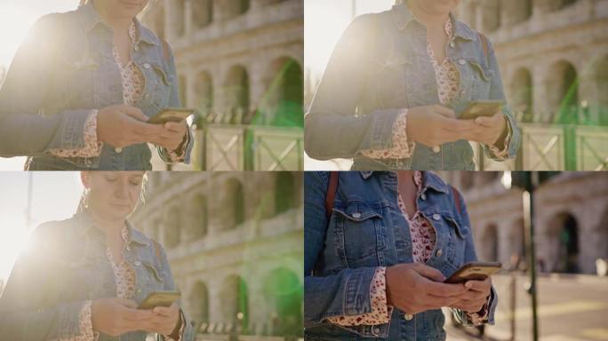 SLO MO女人在罗马罗马斗兽场散步时在手机上打字