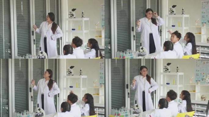 与泰国曼谷学习的老师一起参加科学实验室课程的学生
