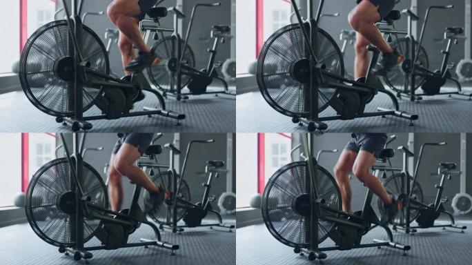 固定自行车，以及忙于锻炼和健身房腿部训练的女性的健身锻炼。运动员的强大运动，健康和健康有氧运动在健身