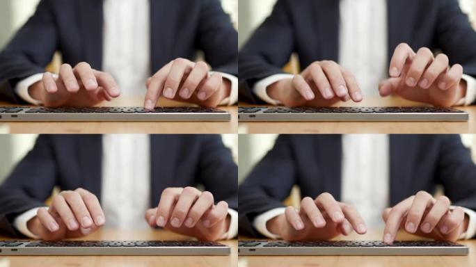 特写工作商人在办公室用电脑键盘打字。人在电脑上写电子邮件或文件。经理在工作场所使用键盘工作。专业用户