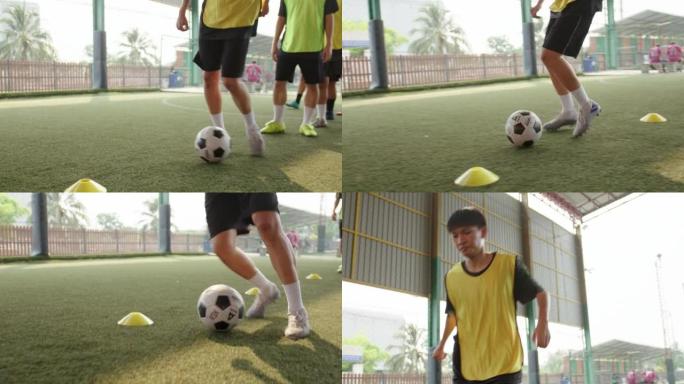 亚洲足球运动员在训练中练习足球