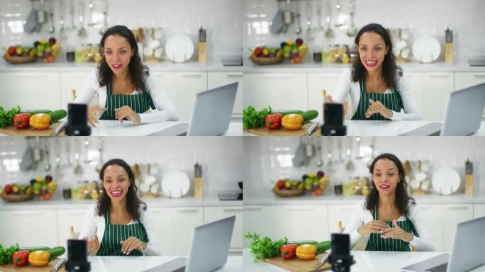 女性视频记录器在生活烹饪课活动中与观众交谈