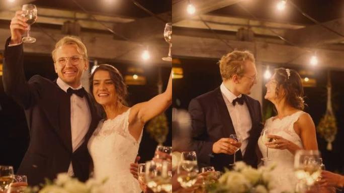 垂直屏幕: 美丽的新娘和新郎在晚会上庆祝婚礼。新婚夫妇提议为幸福的婚姻干杯，与最好的多种族多元朋友站