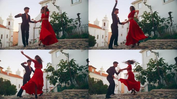 美丽的夫妇在城市老城区的安静街道上跳拉丁舞。在阳光明媚的日子里，两位专业舞者在古老的文化底蕴丰富的旅