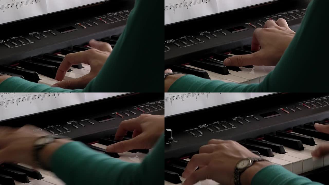 一个年轻女子弹电子琴的手。特写。