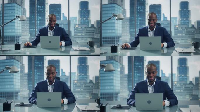 成功的黑人商人在他的大城市办公室里在笔记本电脑上工作的肖像。微笑数字企业家为电子商务战略评估做数据分