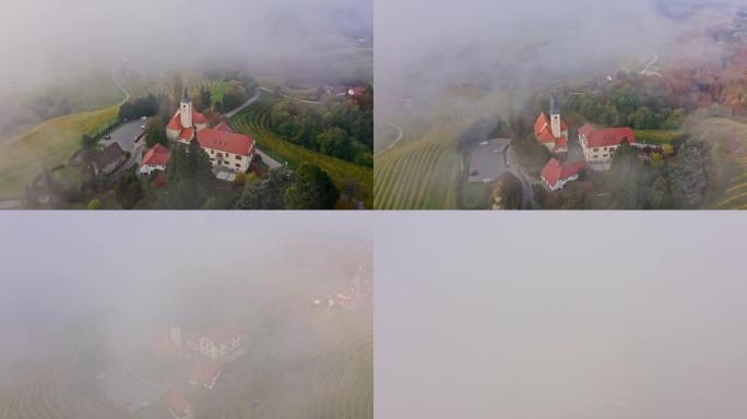 鸟瞰图教堂和被雾覆盖的房屋