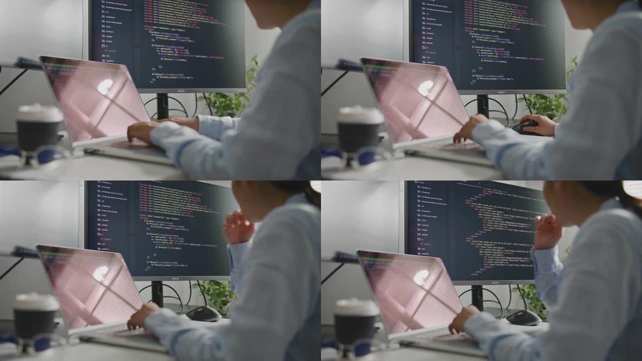 hand亚洲女性软件开发人员使用计算机在办公室编写代码的特写