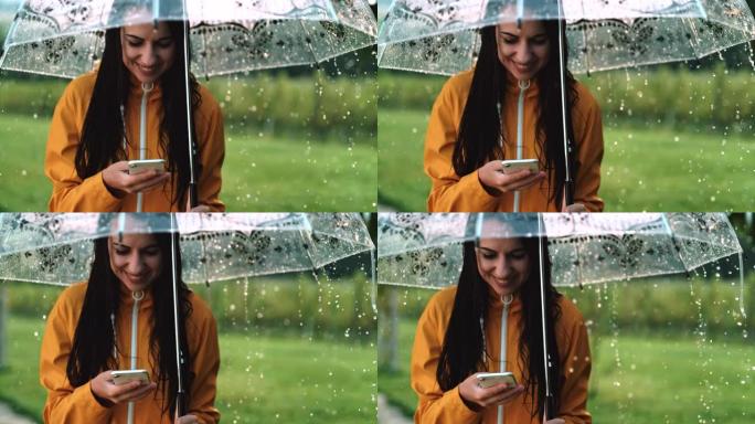 超级SLO MO年轻女子在雨中使用智能手机时微笑