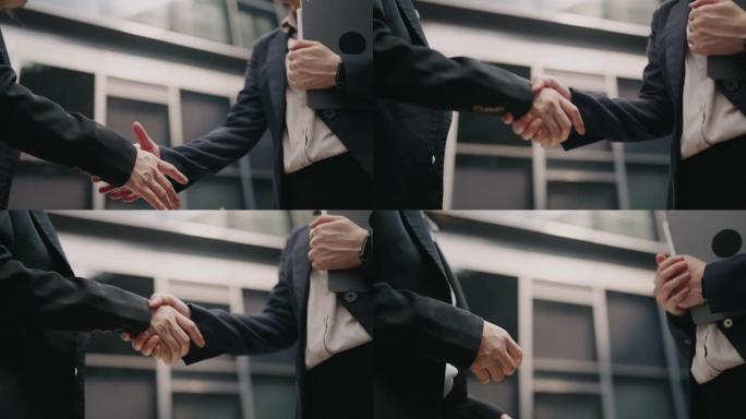 慢动作商务人士在办公室握手