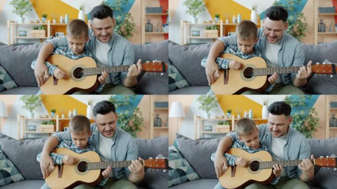 幸福的家庭父子在公寓里一起弹吉他