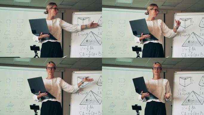 女教师带笔记本电脑正在讲解几何图形