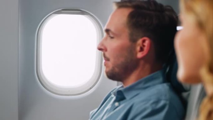 飞机窗欧美男人打开窗户高端商务人士坐飞机
