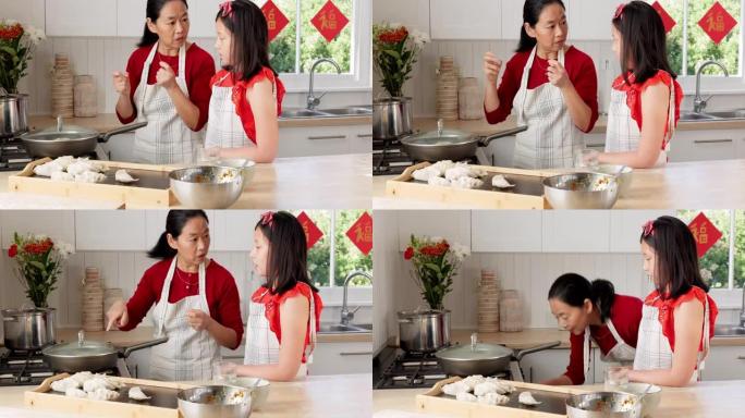 食物，母亲和女孩在厨房里煮饺子，中国菜和在家里的结合。儿童，学习和妈妈在中国的家中帮助女儿提供传统，