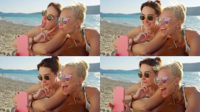 两个朋友躺在沙滩上自拍的4k视频片段