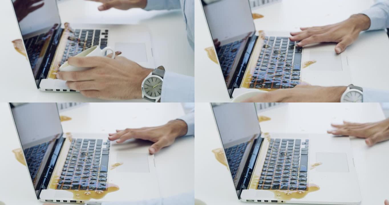 4k视频片段，一个无法识别的商人坐在办公室里，在笔记本电脑上洒了一杯咖啡