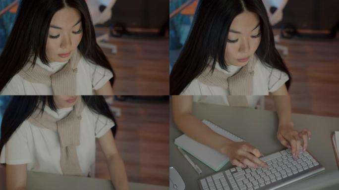 可爱的亚洲女孩在黑暗办公室工作的特写镜头，电脑专注于工作