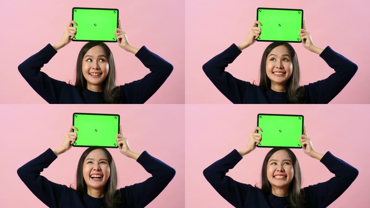 女人对绿屏数字平板电脑的内容感到满意-水平模式