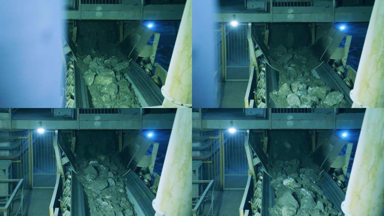 破碎的矿石碎片正在沿着地下机器移动