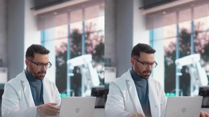 垂直屏幕: 使用笔记本电脑在工业实验室工作的专业男性科学家的肖像。利用技术为工业生产公司制定战略计划