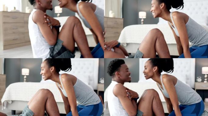 黑人夫妇在卧室地板上用爱和支持一起做运动，亲吻激励。年轻运动，运动员或健康健康的男女家庭健身目标锻炼