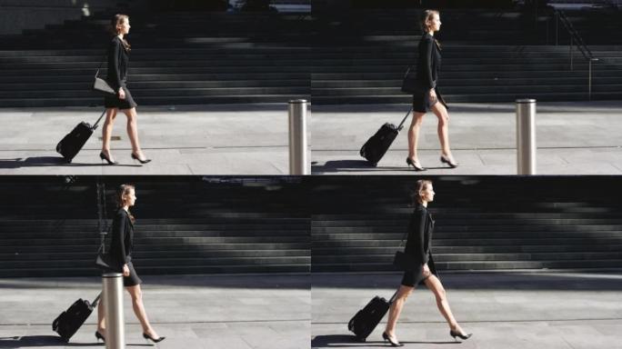 一名女商人带着手提箱去机场的4k视频片段
