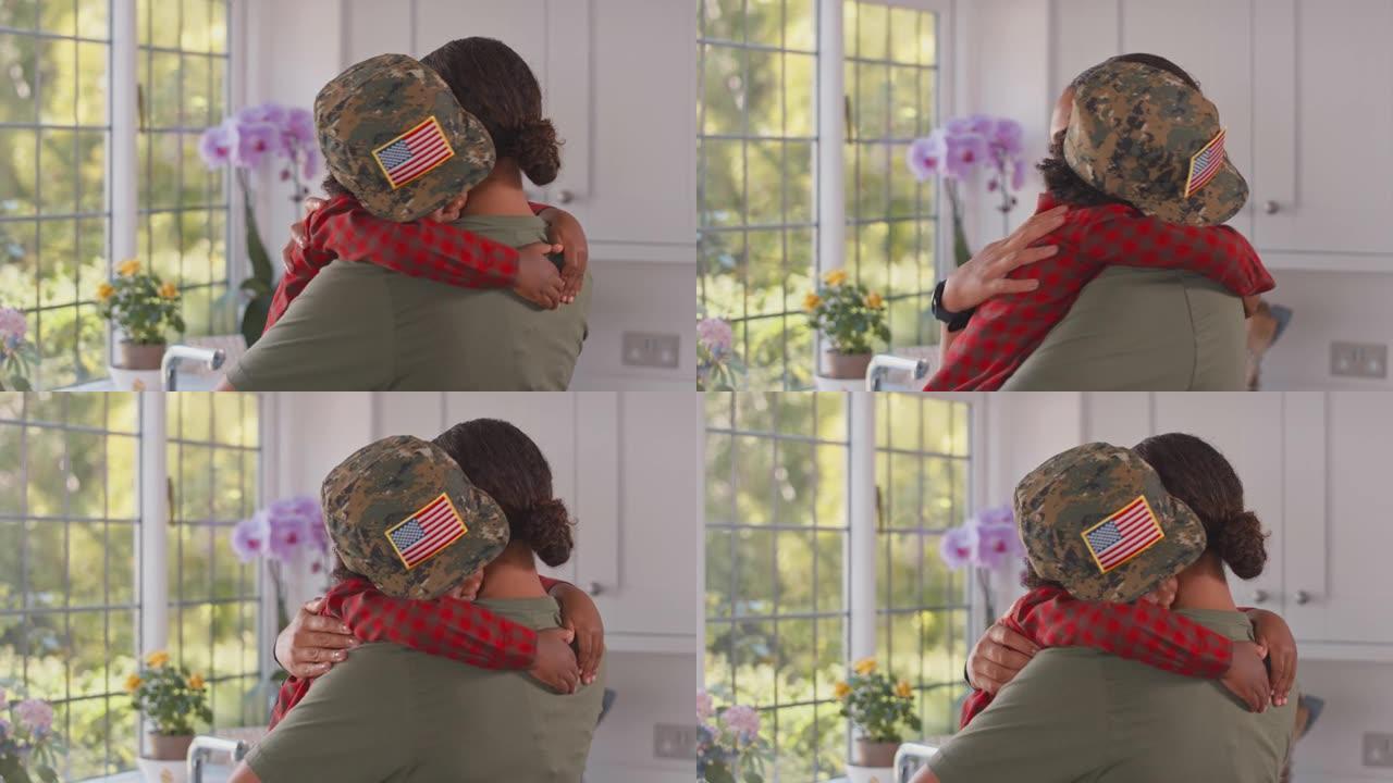 休假回家的美军母亲在厨房抱着戴着军帽的儿子——慢镜头