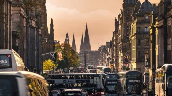 爱丁堡王子街斯科特纪念碑周围的行人人和游客步行和穿越公共汽车的时间流逝