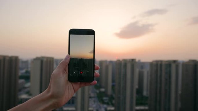 拍摄城市日落拍摄城市日落智能手机