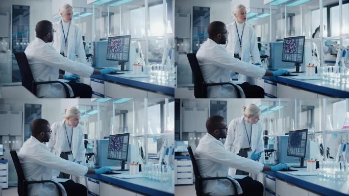 现代医学研究实验室: 两名科学家使用带有显示DNA基因分析屏幕的计算机，专家讨论创新技术。先进的医学