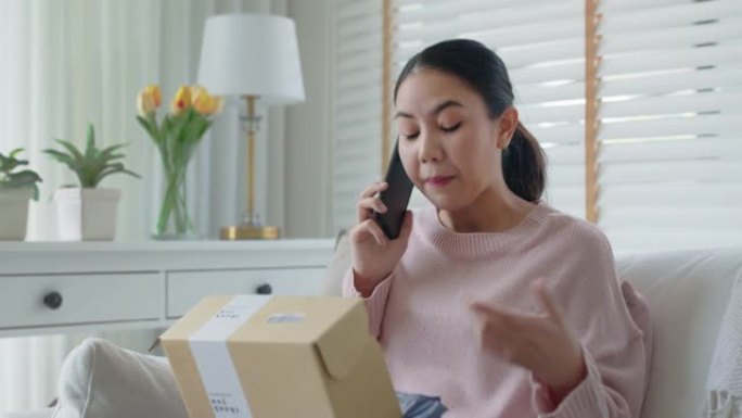 亚洲女人不满意顾客不满意送货电话抱怨。