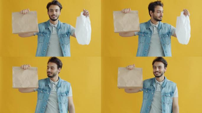 中东家伙选择纸袋而不是塑料和微笑的慢动作肖像