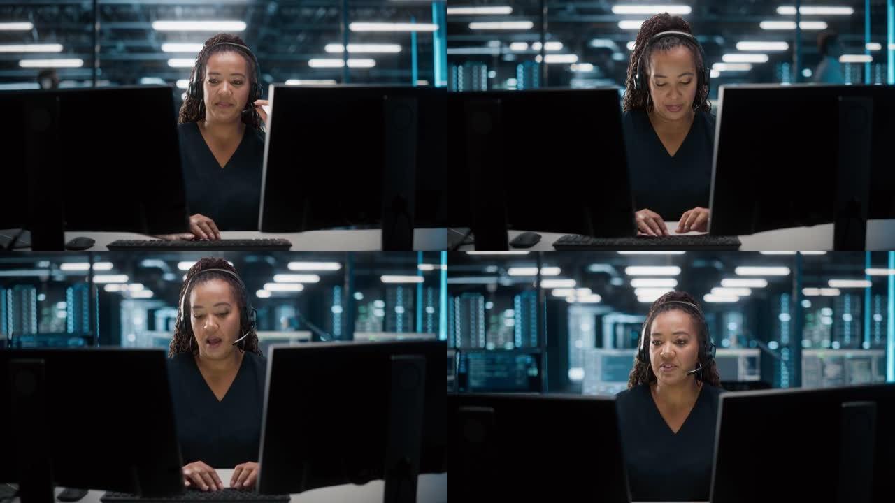 呼叫中心办公室: 友好的非裔美国女性技术客户支持专家的肖像在耳机上交谈，使用计算机。客户体验官通过视