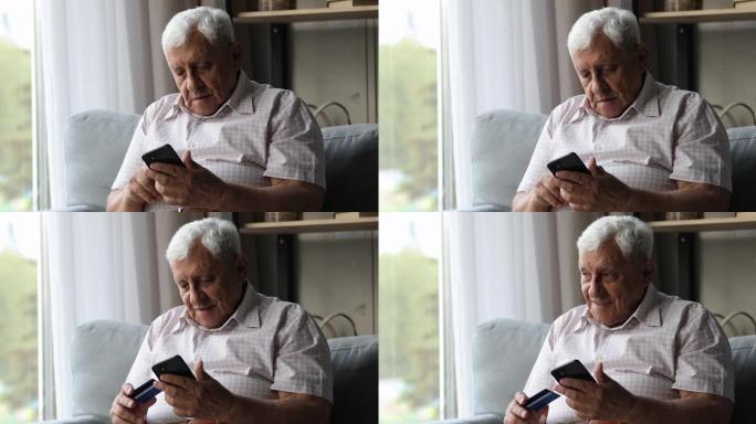微笑的中年男性养老金领取者通过手机在线支付