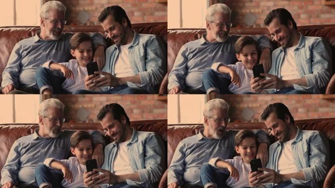 积极的多代家庭在智能手机上观看有趣的视频。